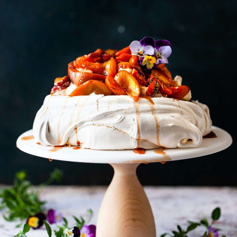 Summer Pavlova with Roasted Stone Fruit and Caramel Drizzle
